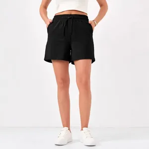 Casual women's black athletic shorts featuring a drawstring elastic waist and pockets