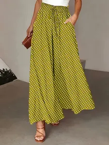 Detail view of bohemian polka dot wide-leg pants featuring high elastic drawstring waist