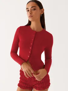 Close-up of a red slim-fit ribbed button-up cardigan for a trendy spring summer style