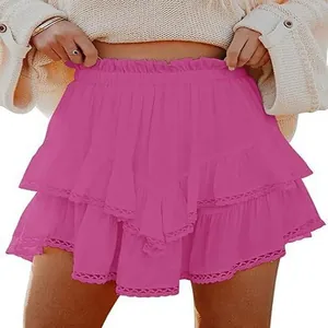 Detail view of Bohemian fuchsia tiered ruffle mini skirt featuring delicate lace trim