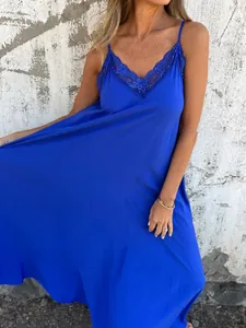 Detail view of the elegant lace neckline on this royal blue strappy maxi dress.