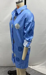 Side view of blue long sleeve polka dot print button-up shirt dress on mannequin