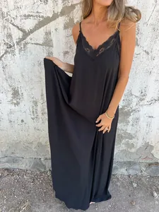 Detailed view of black lace-trimmed maxi camisole nightgown with flowy fabric texture