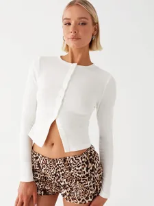 White slim fit long sleeve ribbed knit crop cardigan with buttons detail on model