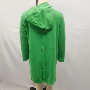 Detail view of green hooded fleece coat featuring three metal rings on the back strap.