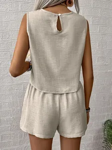 Back view of minimalist beige linen-textured sleeveless top and shorts set