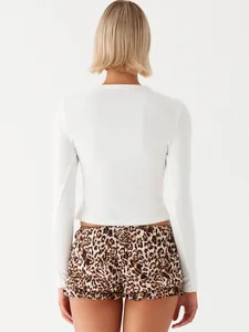Back view detail of a white ribbed long-sleeve slim cropped button cardigan for women