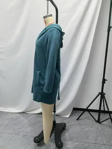Side profile view of a cozy teal fleece hooded jacket with large pockets for women