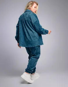 Professional back view of retro plus size teal corduroy shirt and pants set for women