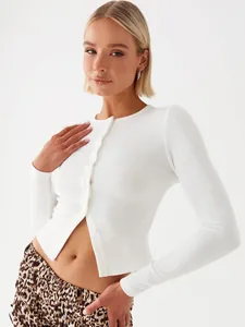 Detailed view of white slim-fit ribbed cardigan with front button closure