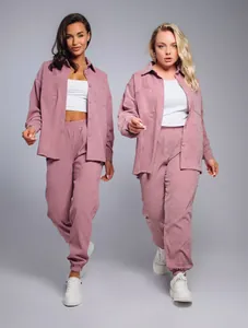 Detail view of mauve corduroy two-piece set featuring oversized shirt and joggers