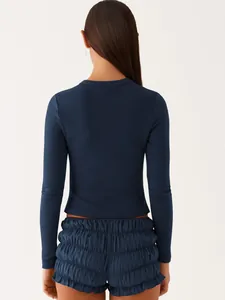 Detailed back view of a navy blue ribbed long-sleeved slim-fit top for stylish women