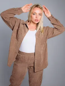 Detail shot of the texture on this retro brown corduroy shirt and pants set for women