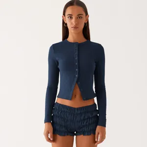 Slim-fit navy blue ribbed button cardigan with matching ruffled shorts for women.