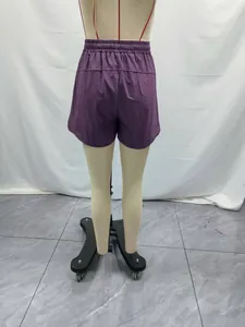 Detailed back view of purple 5-inch women's quick-dry lightweight fitness shorts