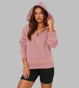 Casual women's half-zip hooded sweatshirt in mauve pink with contrast stitch detail