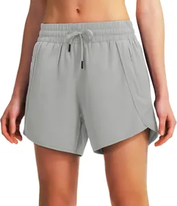 Detail of gray quick-dry athletic shorts with drawstring waistband and zipper pockets