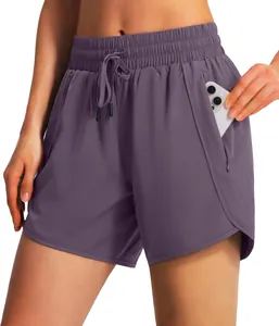 Detail view of purple women's running shorts featuring a functional side zip pocket