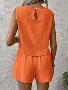 Back view of orange sleeveless top and shorts set with keyhole button detail
