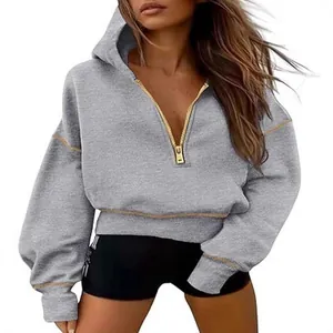 Grey women's half-zip cropped hoodie sweatshirt with gold zipper and stitching detail