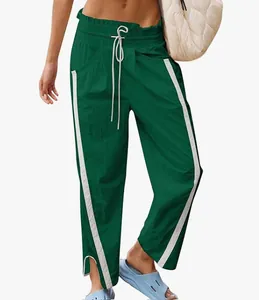 Detailed view of women's Y2K high-waist drawstring sports pants with white side stripes