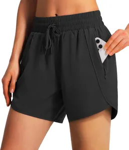 Detail view of black 5-inch running shorts showing a side pocket containing a white smartphone