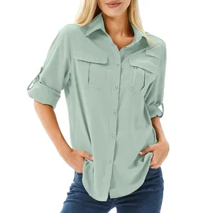 Close-up of women's quick-dry hiking shirt with multiple functional pockets and rolled-up sleeves