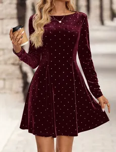 Detail showing the burgundy velvet texture and polka dot pattern of the retro mini dress.