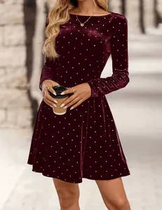 Close-up of vintage burgundy velvet dress featuring elegant white polka dot rhinestones
