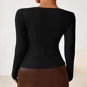 Back view of a slim-fit black long sleeve top for women showing body-hugging silhouette