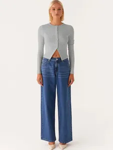 Full-length front view of model wearing a slim-fit grey ribbed button-down cardigan