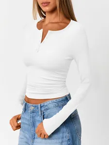 Detailed view of white ribbed knit long-sleeve Henley shirt with button neckline detail