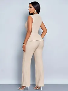Rear view of beige two-piece set featuring sleeveless peplum top and wide-leg trousers.