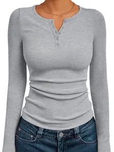 Close-up of women's gray ribbed knit long-sleeved Henley top with button details