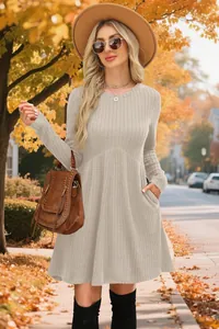 Detailed view of beige ribbed long sleeve dress featuring side pockets and autumn vibes