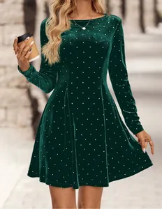 Close-up detail view of a vintage dark green velvet mini dress with sparkling polka dots