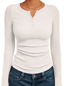 Detailed view of women's white ribbed long-sleeve Henley top featuring front buttons