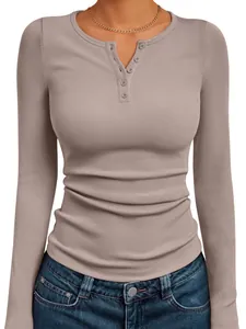 Close-up view of a slim fit women's long sleeve ribbed henley top featuring button details