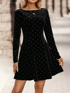 Retro black velvet mini dress featuring rhinestone polka dots and a slim fit waist design.
