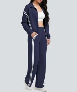 Chándal de dos piezas para mujer en azul marino con franjas laterales blancas y pantalón ancho