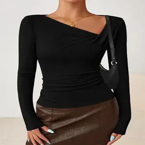 Elegant women's black slim fit long sleeve top featuring an asymmetrical neckline
