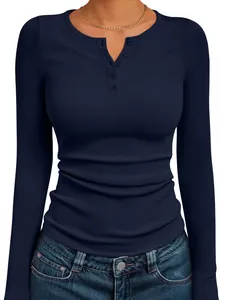 Close-up of a women's navy blue ribbed knit Henley top featuring stylish button details.