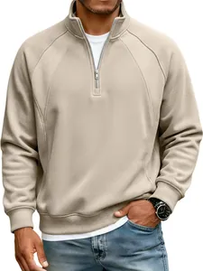 Detail of men's beige half-zip sweatshirt featuring a stand collar and raglan sleeves