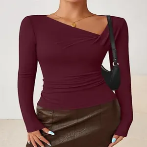 Elegant burgundy slim fit long sleeve top featuring an irregular V-neck and stylish ruched waist