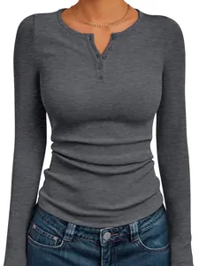 Detail view of grey ribbed long sleeve henley top with button neckline texture