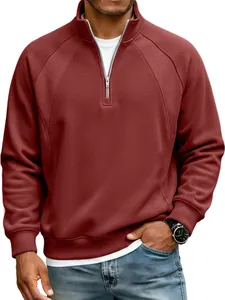Detailed view of men's burgundy half-zip sweatshirt with raglan sleeves and stand collar