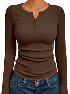 Close-up detail of women's brown ribbed knit long sleeve Henley top with buttoned neckline