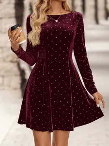 Vintage burgundy velvet mini dress with silver rhinestone polka dots and long sleeves.