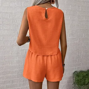 Casual orange sleeveless two-piece summer set for women featuring elegant back keyhole detail