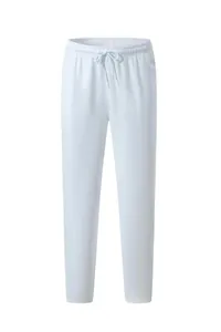 Detail view of white drawstring waistband on athletic straight-leg sweatpants